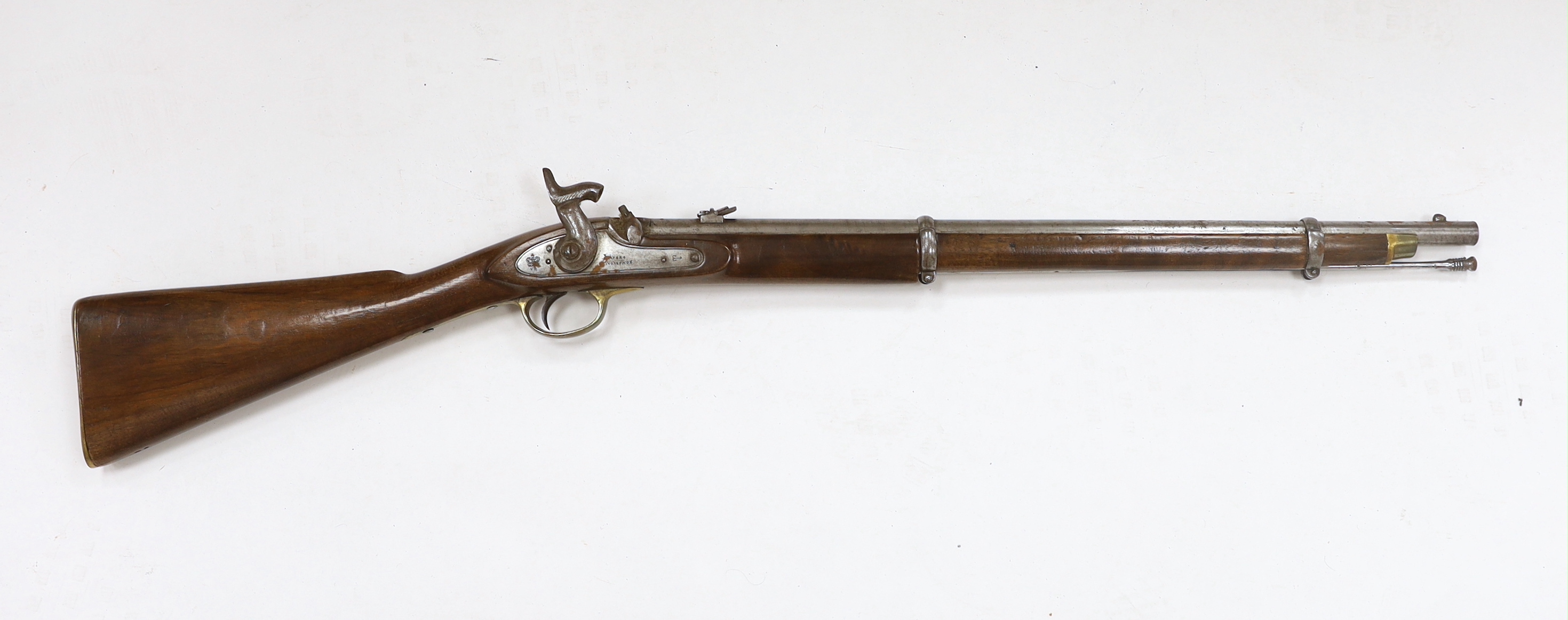 A two band percussion Military carbine of Indian use, regulation brass mounts, fold leaf rear sight, regulation brass mount, lock with Indian marks and also crowned VR, barrel 66.2cm